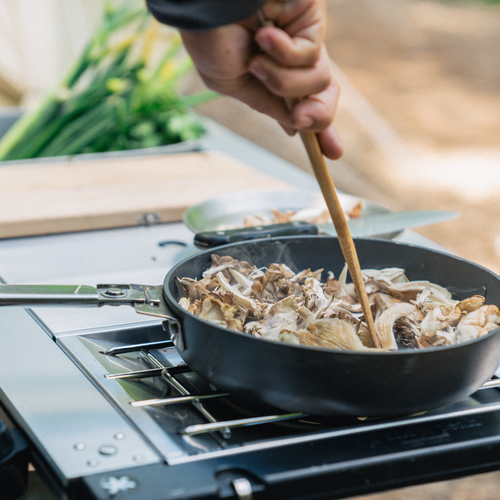 Preparing food at a Snow Peak IGT camp kitchen