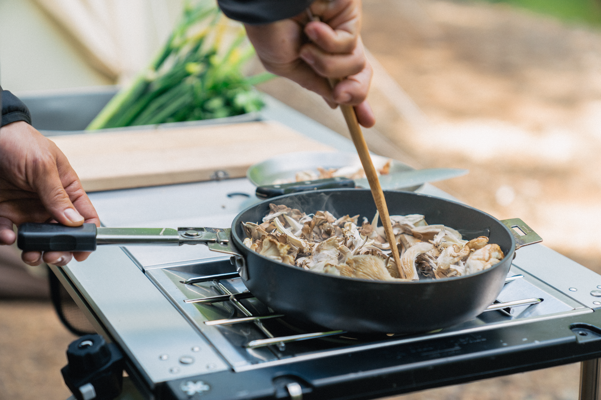 Preparing food at a Snow Peak IGT camp kitchen