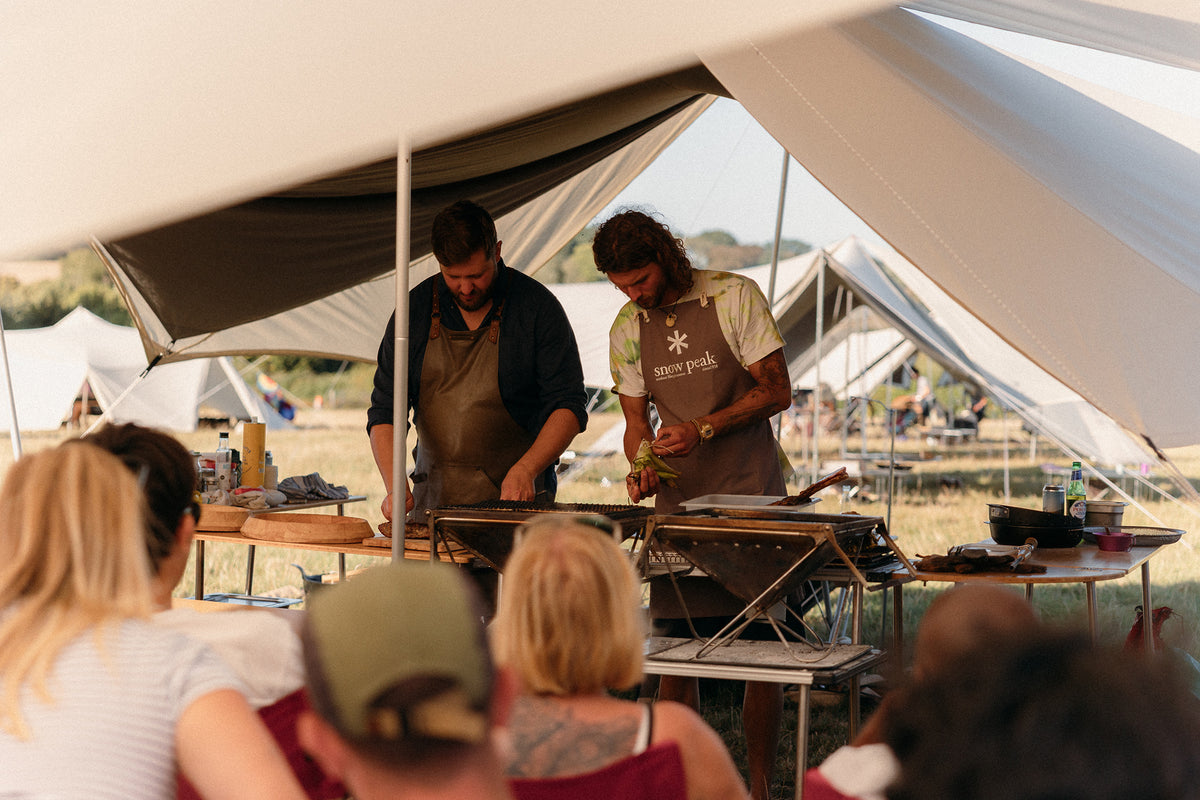Chef Ivan Tisdall-Downes cooking at the Snow Peak Way